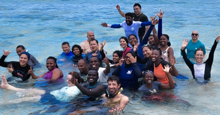 Workshop participants in the water